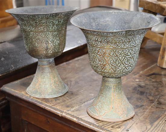 A pair of Middle Eastern pedestal vases height 27cm